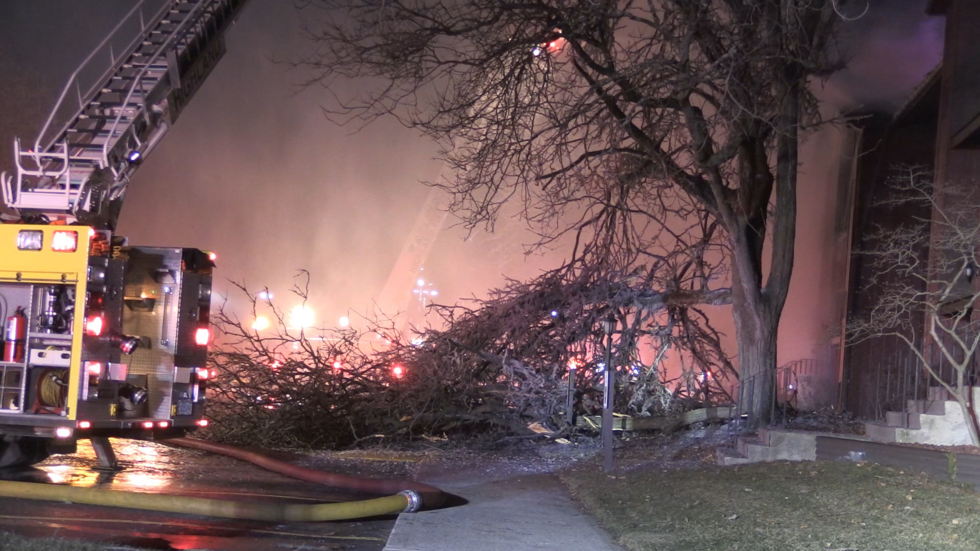 Firefighters continue to battle apartment building fire